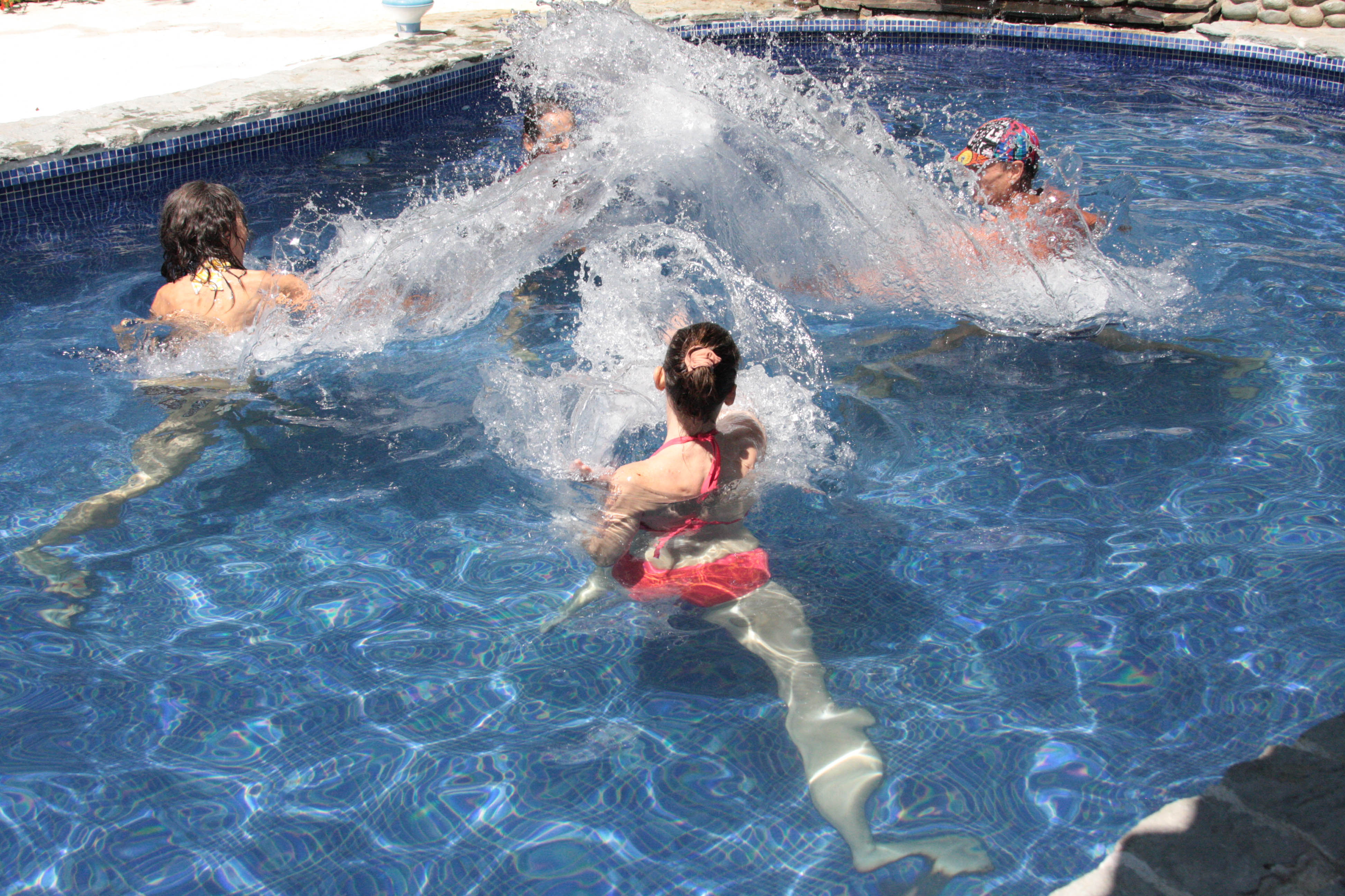 [Image:People Spash Exercise in Pool]